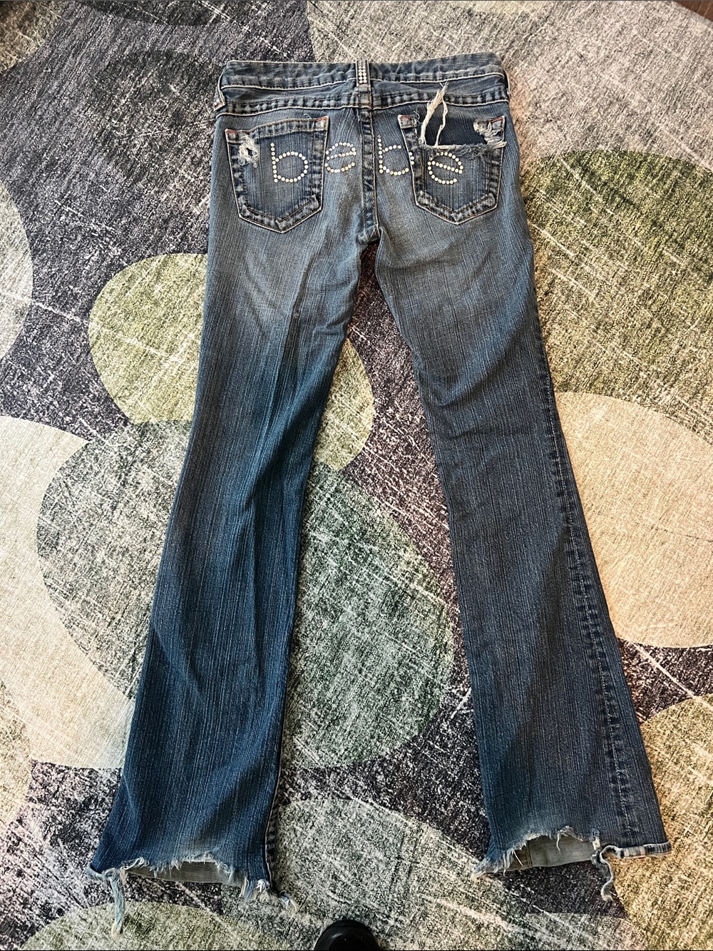 Bebe Distressed Flare Jeans in Medium Blue Wash